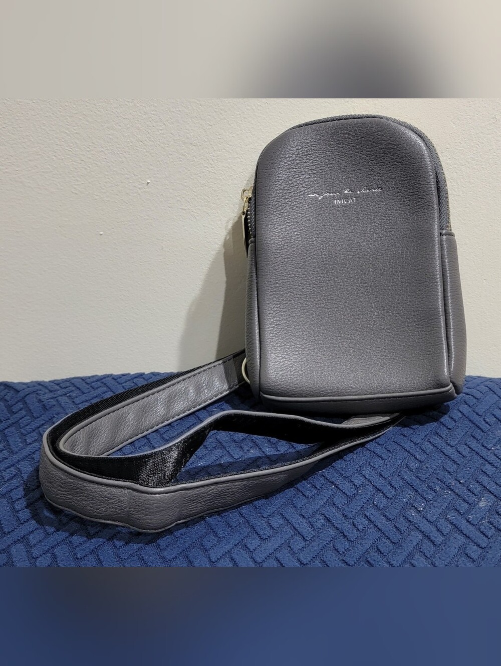 Compact Gray Pebbled Crossbody Bag with Adjustable Strap